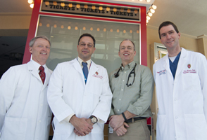 The multidisciplinary pediatric heart program team includes, from left, pediatric intensivist Scott Hagen, MD; pediatric cardiothoracic surgeon Petros Anagnostopoulos, MD; pediatric cardiology chief J. Carter Ralphe, MD, and pediatric interventional cardiologist Luke Lamers, MD.